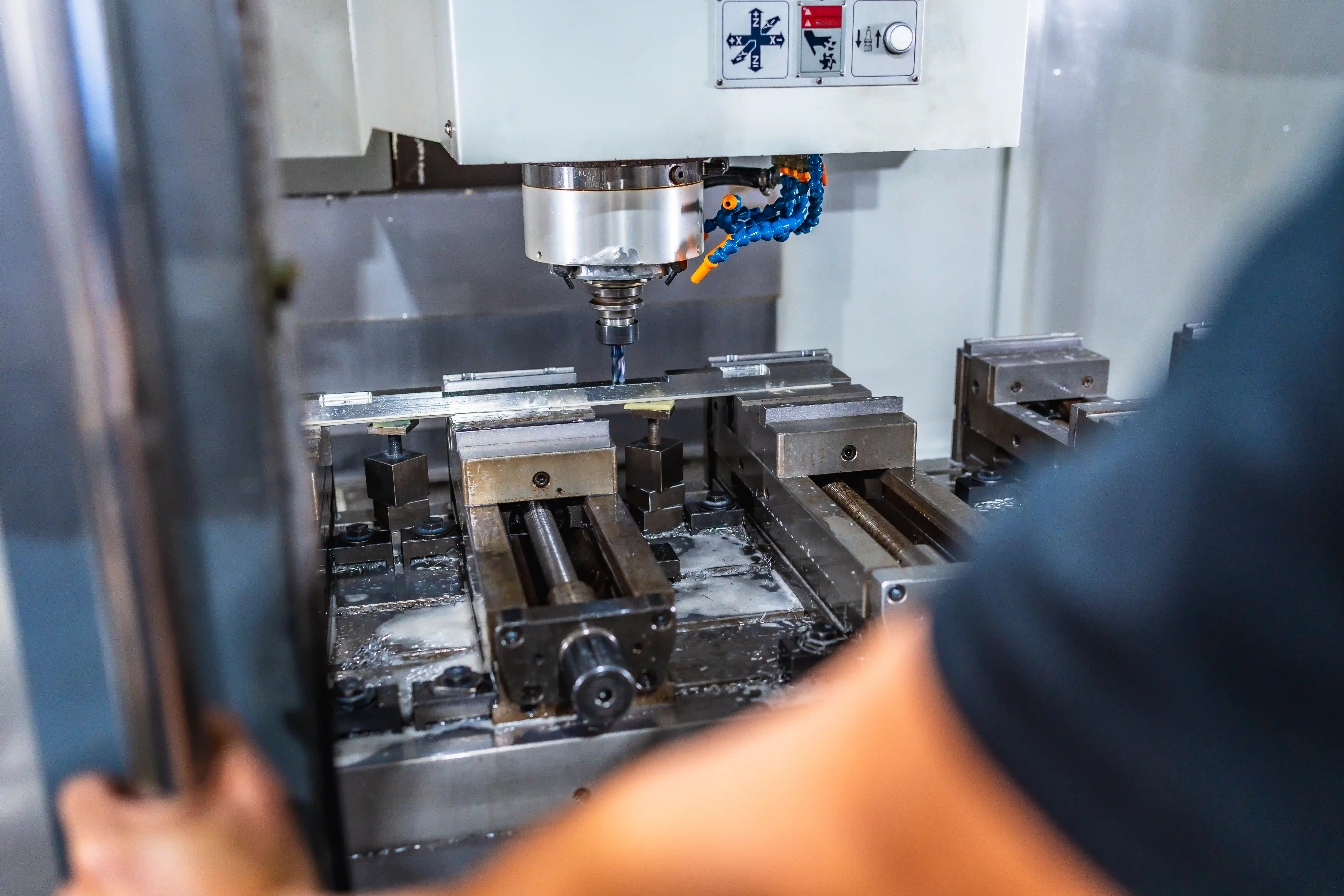 man-working-with-milling-machine-in-cnc-factory-2024-12-10-03-24-00-utc.webp